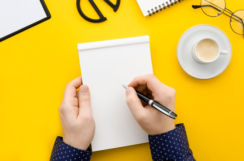 birds eye view of someone that makes money writing